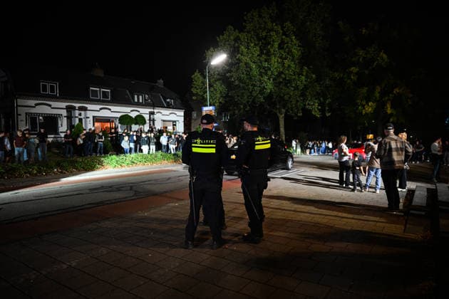 Clashes erupt as anti-asylum protesters confront police in Dutch town of Rhenen RHENEN, NETHERLANDS - SEPTEMBER 30: Protesters clash with riot police outside Rhenen Town Hall during demonstrations against proposed municipal plans to establish an asylum-seeker and refugee reception center in Rhenen, Netherlands on September 30, 2026. Tensions escalated as masked demonstrators launched fireworks at police cordons guarding the building, prompting riot squads to push back crowds and detain multiple individuals as security forces cleared the central square. Mouneb Taim Anadolu Rhenen Netherlands. Editorial use only. Please get in touch for any other usage.  Copyright: x2026xAnadoluxMounebxTaimx