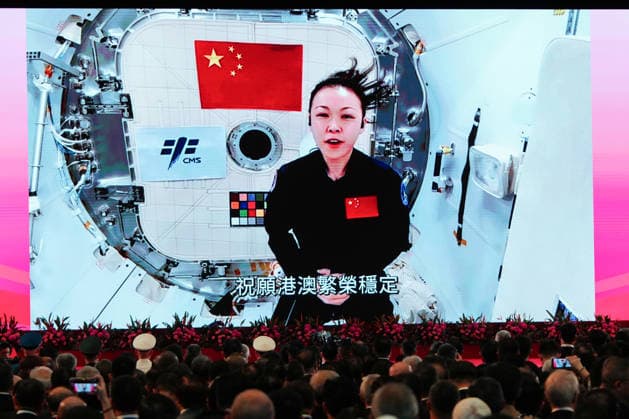 HONG KONG-DAILY NATIONAL-DAY A giant LED screen displays a pre-recorded video address from Hong Kong s first payload specialist, Lai Ka-ying, speaking from aboard China s Tiangong space station during the Shenzhou-23 mission, as she delivers National Day congratulations and wishes prosperity and stability for Hong Kong and Macao during the reception at the Hong Kong Convention and Exhibition Centre on October 1, 2026 in Hong Kong. (Photo by Zulu Lo TMHK via Nexpher Images) Hong Kong