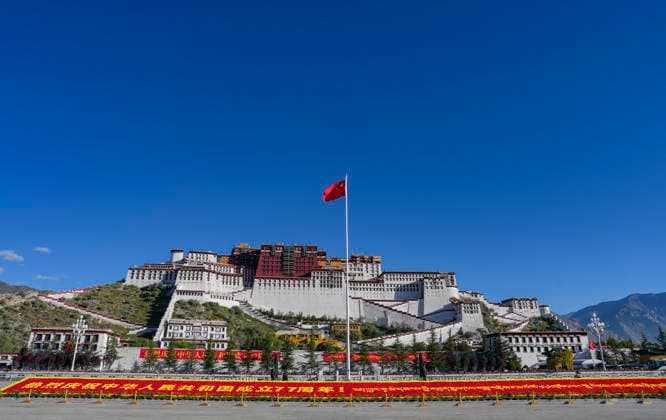 (261001) -- BEIJING, Oct. 1, 2026 -- A Chinese national flag flies at the Potala Palace square in Lhasa, southwest China s Xizang Autonomous Region, Oct. 1, 2026. People celebrated the 77th anniversary of the founding of the People s Republic of China in various ways on Thursday. ) CHINA-NATIONAL DAY-CELEBRATION (CN) JigmexDorje 