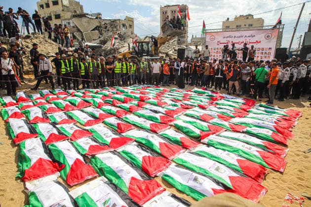 Funeral Held For Palestinians Killed In Israel-Hamas War - Gaza A mass funeral takes place for 110 Palestinians who were killed in Israeli strikes early in the Israel-Hamas war on October 1, 2026 in Gaza City, Gaza. The remains of the victims have recently been recovered from the rubble of buildings destroyed in the Al-Taj area of Gaza City. Ramez Photo by Habboub ABACAPRESS.COM Gaza Palestine  Copyright: xHabboubxRamez ABACAx