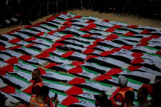 RECORD DATE NOT STATED Funeral Held for Palestinians Killed in Israel-Hamas War (INT) Funeral Held for Palestinians Killed in Israel-Hamas War. October 1, 2026, Gaza, Palestine: A mass funeral is held for 105 Palestinians who were killed in Israeli strikes during the early stages of the Israel-Hamas war. The remains of the victims were recently recovered from beneath the rubble of buildings destroyed in the Al-Taj area of Gaza City. Families and mourners gather to pay their respects. Credit: Hashem Zimmo TheNews2(Foto: Hashem Zimmo Thenews2 imago images) Funeral Held for Palestinians Killed in Israel-Hamas War  Copyright: xHashemxZimmox