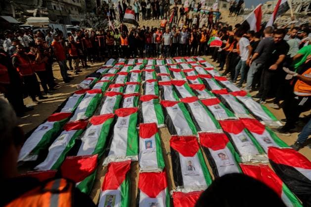 RECORD DATE NOT STATED Funeral Held for Palestinians Killed in Israel-Hamas War (INT) Funeral Held for Palestinians Killed in Israel-Hamas War. October 1, 2026, Gaza, Palestine: A mass funeral is held for 105 Palestinians who were killed in Israeli strikes during the early stages of the Israel-Hamas war. The remains of the victims were recently recovered from beneath the rubble of buildings destroyed in the Al-Taj area of Gaza City. Families and mourners gather to pay their respects. Credit: Hashem Zimmo TheNews2(Foto: Hashem Zimmo Thenews2 imago images) Funeral Held for Palestinians Killed in Israel-Hamas War  Copyright: xHashemxZimmox