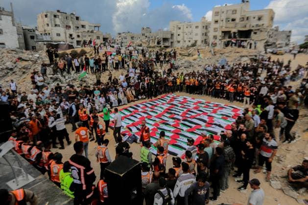 RECORD DATE NOT STATED Funeral Held for Palestinians Killed in Israel-Hamas War (INT) Funeral Held for Palestinians Killed in Israel-Hamas War. October 1, 2026, Gaza, Palestine: A mass funeral is held for 105 Palestinians who were killed in Israeli strikes during the early stages of the Israel-Hamas war. The remains of the victims were recently recovered from beneath the rubble of buildings destroyed in the Al-Taj area of Gaza City. Families and mourners gather to pay their respects. Credit: Hashem Zimmo TheNews2(Foto: Hashem Zimmo Thenews2 imago images) Funeral Held for Palestinians Killed in Israel-Hamas War  Copyright: xHashemxZimmox