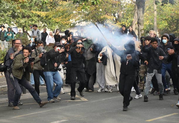 Student protest in Paris PARIS, FRANCE - SOCTOBER 1: A masked protester carries a smoke canister to throw at French riot police during a protest by high school and university students near Lycee Paul Eluard high school in Saint-Denis, near Paris, France, on October 1, 2026. Mohamad Salaheldin Abdelghani Alsayed Anadolu Paris France. Editorial use only. Please get in touch for any other usage.  Copyright: x2026xAnadoluxMohamadxSalaheldinxAbdelghanixAlsayedx