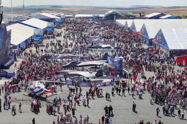 TEKNOFEST Southeast in Turkiye s Sanliurfa SANLIURFA, TURKIYE - OCTOBER 1: People walk through stalls during the second day of the TEKNOFEST aviation, space, and technology festival at Sanliurfa GAP Airport in Sanliurfa, Turkiye, on October 1, 2026. Ozkan Bilgin Anadolu Sanliurfa Turkey. Editorial use only. Please get in touch for any other usage.  Copyright: x2026xAnadoluxOzkanxBilginx