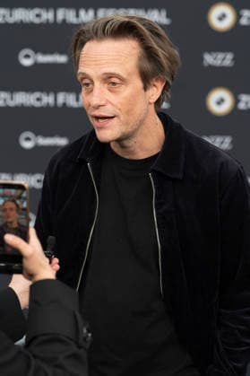 August Diehl bei der Premiere des Kinofilms Vaterland auf dem 22. Zurich Film Festival im Arthouse Le Paris. Zürich, 01.10.2026
