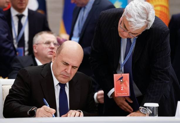 Belarus Eurasian Intergovernmental Council 9256201 02.10.2026 Russian Prime Minister Mikhail Mishustin attends a signing ceremony following an expanded format meeting of the Eurasian Intergovernmental Council, as Deputy Chief of the Russian Government Staff Elmir Tagirov stands nearby, in Minsk, Belarus. Dmitry Astakhov Sputnik Minsk Belarus  Copyright: xDmitryxAstakhovx