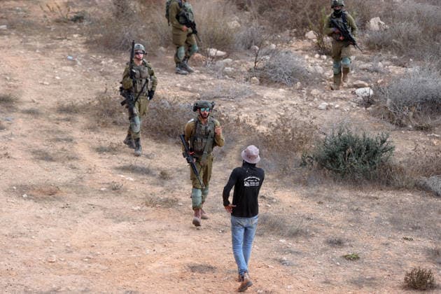 Israeli settlers intervene against Palestinians olive-picking event in Nablus town NABLUS, WEST BANK, PALESTINE - OCTOBER 02: Israeli settlers, under the protection of Israeli forces, intervene against an olive-picking event organized by Palestinians and a group of activists in the town of Beita, in Nablus, West Bank, Palestine on October 02, 2026. Issam Rimawi Anadolu Nablus West Bank. Editorial use only. Please get in touch for any other usage.  Copyright: x2026xAnadoluxIssamxRimawix