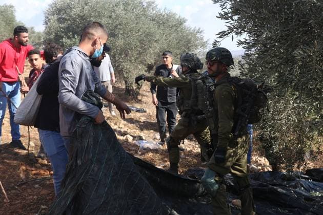 Israeli Settlers And Forces Attacked Palestinian Farmers During Olive Harvest In Beita BEITA, NABLUS, PALESTINE OCTOBER 2, 2026: Israeli settlers and Israeli forces attacked Palestinian farmers while they were picking olives in the Jabal Al-Arma area, east of Beita, south of Nablus. Settlers fired live ammunition toward the farmers, with no injuries reported. According to the Palestinian Red Crescent Society, Israeli forces also beat a 46-year-old Palestinian farmer during raids on olive farms in Beita. Witnesses told Anadolu that Israeli forces fired stun grenades and tear gas at farmers in the Jabal Al-Arma area, forcing them to leave. The olive harvest begins in early October and continues through the end of November, making it an im Copyright: x xSalmanxMohsenxAlkhatibx xJNAxPressx