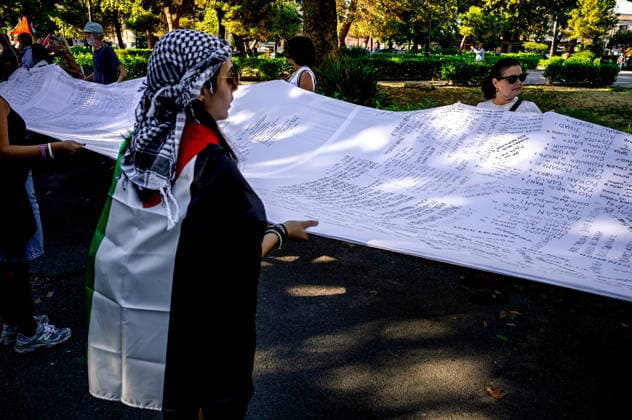 Shroud of Living Memory™, Demonstration for child deaths in Gaza PALERMO, ITALY - OCTOBER 2: The ˜Sudario della Memoria Viva™ (Shroud of Living Memory), a cloth approximately 70 metres long bearing the names of 18,500 Palestinian children killed in Gaza, is carried by demonstrators during a rally in support of Gaza on 2 October 2026 in Palermo, Italy. Palermo Sicily Italy Copyright: xStefanoxMontesix