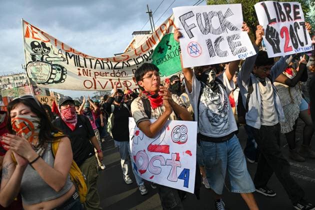October 2, 2026: TO-45322-MEXICO , October 2, 2026. Student leaders from 1968 marched alongside students from various public universities, feminist collectives, "searching mothers," and Indigenous people from diverse regions to commemorate the anniversary of the Tlatelolco Massacre. They chanted slogans such as "No forgiveness, no forgetting," "Death to the State," and "It was the military." They marched along various avenues in the Mexican capital, concluding their rally at the Z& xf3;calo plaza, where clashes broke out with police stationed behind the barriers guarding the National Palace. In Mexico City. Clasos.com.mx - ZUMAcs4_ 20261002_faa_cs4_128 Copyright: xJavierxLiraxOterox