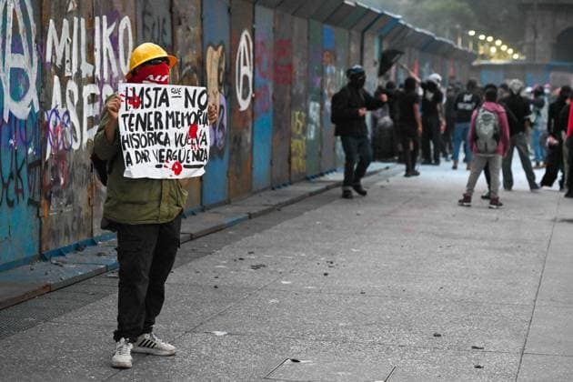 October 2, 2026: TO-45322-MEXICO , October 2, 2026. Student leaders from 1968 marched alongside students from various public universities, feminist collectives, "searching mothers," and Indigenous people from diverse regions to commemorate the anniversary of the Tlatelolco Massacre. They chanted slogans such as "No forgiveness, no forgetting," "Death to the State," and "It was the military." They marched along various avenues in the Mexican capital, concluding their rally at the Z& xf3;calo plaza, where clashes broke out with police stationed behind the barriers guarding the National Palace. In Mexico City. Clasos.com.mx - ZUMAcs4_ 20261002_faa_cs4_124 Copyright: xJavierxLiraxOterox