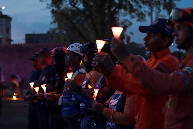 October 2, 2026, La Guaira, Venezuela (Bolivarian Republic of: LA GUAIRA, VENEZUELA, OCTOBER 2, 2026: Families of victims, survivors and rescue workers gather during the Haz de Luz vigil in La Guaira to commemorate 100 days since the devastating earthquakes of June 24. Participants lit candles and joined prayers in memory of those killed and missing, while beams of light were projected into the sky near areas heavily damaged by the disaster. The commemorative event brought together residents, volunteers and emergency workers as recovery and search efforts continue in parts of La Guaira. La Guaira Venezuela (Bolivarian Republic of - ZUMAq101 20261002_zna_q101_320 Copyright: xMarioxFloresx