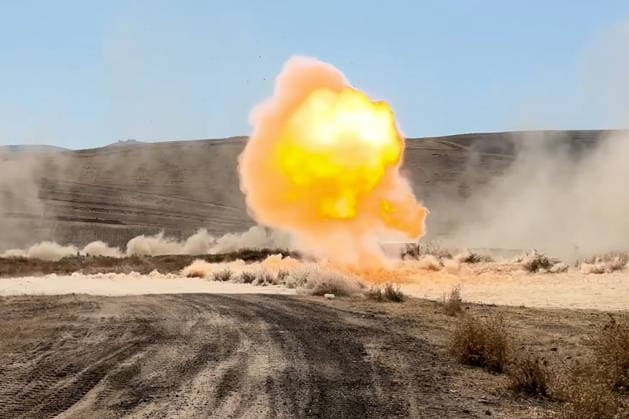 TAJIKISTAN - OCTOBER 3, 2026: Russian tank crews destroy a simulated enemy during the Tsentr Centre 2026 military exercise held at the Lyaur training ground. Video screen grab. Best quality available. Russian Defence Ministry TASS  98708971