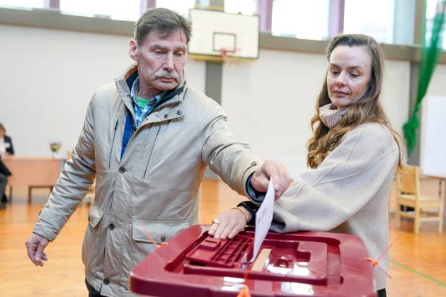 October 3, 2026, Riga, LATVIA: Man casts his vote at a polling station during the parliamentary elections in Riga, Latvia, Oct. 3, 2026. Riga LATVIA  - ZUMAp305 20261003_zip_p305_009 Copyright: xEdijsxPalensx