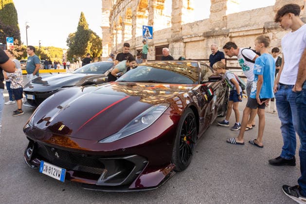 Ferrari Tour stops in Pula Luxury Ferrari sports cars taking part in a Ferrari Tour organized by Ineco Auto, are seen in front of the Roman Arena in Pula, Croatia, on October 3, 2026. While the drivers visit the ancient amphitheatre, local residents gather to watch and admire the vehicles.  SreckoxNiketic PIXSELL