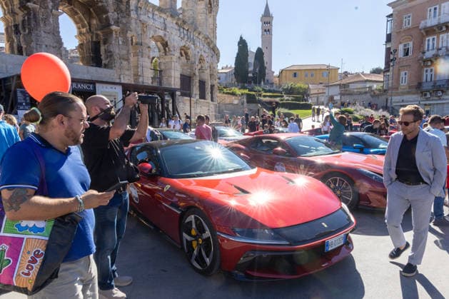 Ferrari Tour stops in Pula Luxury Ferrari sports cars taking part in a Ferrari Tour organized by Ineco Auto, are seen in front of the Roman Arena in Pula, Croatia, on October 3, 2026. While the drivers visit the ancient amphitheatre, local residents gather to watch and admire the vehicles.  SreckoxNiketic PIXSELL