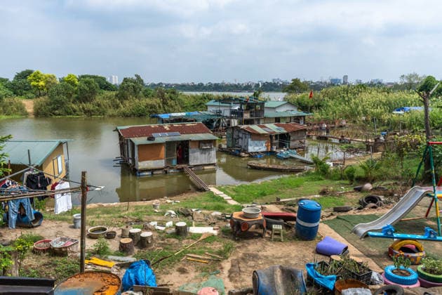 Floating homes offer a way of life adapted to recurrent flooding in Hanoi HANOI, VIETNAM - OCTOBER 3: Residents go about their daily lives in a floating village built in an area that is regularly affected by flooding, with homes designed to rise with changing water levels, as seen in Hanoi, Vietnam, on October 3, 2026. The floating homes allow residents to adapt to recurring floods while continuing to live and work in the area. Magdalena Chodownik Anadolu Hanoi Vietnam. Editorial use only. Please get in touch for any other usage.  Copyright: x2026xAnadoluxMagdalenaxChodownikx
