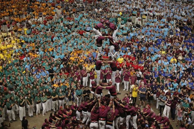 Human tower groups perform in the 30th Concurs de Castells competition in Tarragona TARRAGONA, SPAIN - OCTOBER 3: Members of human tower groups (colles) build intricate human towers (castells) during the competition section of the 30th Concurs de Castells at the Tarraco Arena Placa in Tarragona, Spain on October 3, 2026. The biennial event, recognized as UNESCO Intangible Cultural Heritage, gathers top teams from across Catalonia to construct towering multi-tiered human structures. Senhan Bolelli Anadolu Tarragona Spain. Editorial use only. Please get in touch for any other usage.  Copyright: x2026xAnadoluxSenhanxBolellix