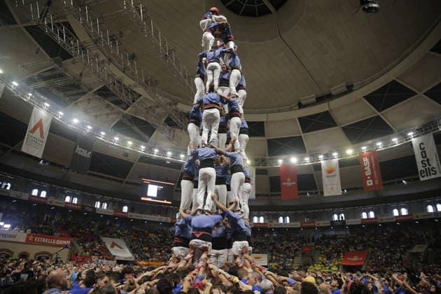 Human tower groups perform in the 30th Concurs de Castells competition in Tarragona TARRAGONA, SPAIN - OCTOBER 3: Members of human tower groups (colles) build intricate human towers (castells) during the competition section of the 30th Concurs de Castells at the Tarraco Arena Placa in Tarragona, Spain on October 3, 2026. The biennial event, recognized as UNESCO Intangible Cultural Heritage, gathers top teams from across Catalonia to construct towering multi-tiered human structures. Senhan Bolelli Anadolu Tarragona Spain. Editorial use only. Please get in touch for any other usage.  Copyright: x2026xAnadoluxSenhanxBolellix