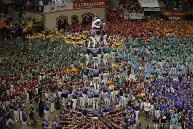 Human tower groups perform in the 30th Concurs de Castells competition in Tarragona TARRAGONA, SPAIN - OCTOBER 3: Members of human tower groups (colles) build intricate human towers (castells) during the competition section of the 30th Concurs de Castells at the Tarraco Arena Placa in Tarragona, Spain on October 3, 2026. The biennial event, recognized as UNESCO Intangible Cultural Heritage, gathers top teams from across Catalonia to construct towering multi-tiered human structures. Senhan Bolelli Anadolu Tarragona Spain. Editorial use only. Please get in touch for any other usage.  Copyright: x2026xAnadoluxSenhanxBolellix