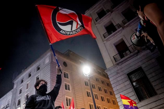 Protest Rally Against the Sol Camp in Madrid A group of people is demonstrating against the rally organized by Núcleo Nacional at Puerta del Sol on October 3, 2026, in Madrid, Spain. The platform Indignados por Espana is organizing the demonstration against the Sol encampment, in support of social and national housing, mass deportations, and the defense of national sovereignty following the invasion of Ceuta. OCTOBER 3, 2026. NUCLEO NACIONAL. PROTEST. HOUSING. FLAG. HOODED PROTESTERS. POLICE. ANTIFASCIST ACTION. ANTIFASCISTS. ON FOOT IN MADRID Madrid, Spain  Copyright: xA.xPÃ rezxMecax 7818919