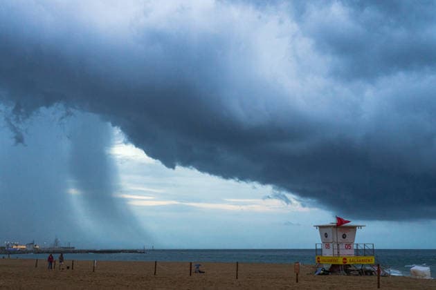 Red alert for extreme weather in Barcelona, Spain. Storm clouds from Sant SebastiÃ beach during red alert for extreme weather in Promenade, Barcelona, Spain, on October 3, 2026. Barcelona Promenade Barcelona Spain