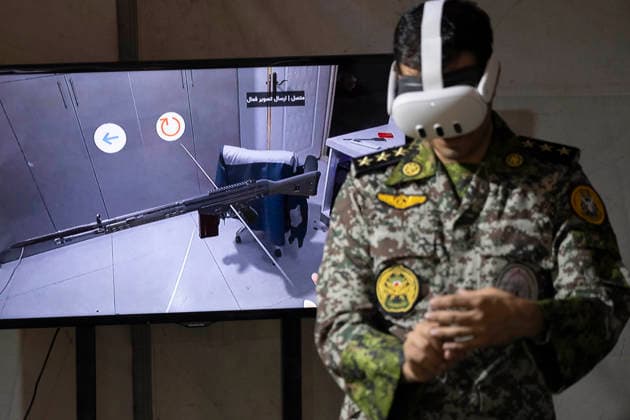 Opening Ceremony Of Second City-Square Military Training Camp An Iranian Army serviceman wears a virtual reality headset to shoot with a virtual rifle during the opening ceremony of the second city-square military training camp for self-sacrificing forces in downtown Tehran, Iran, on October 3, 2026. The camp was established by the Basij paramilitary force, with personnel from the Islamic Republic of Iran Army responsible for training the volunteers. Tehran Tehran Iran  Copyright: xMortezaxNikoubazlx originalFilename: nikoubazl-openingc261003_npkJa.jpg