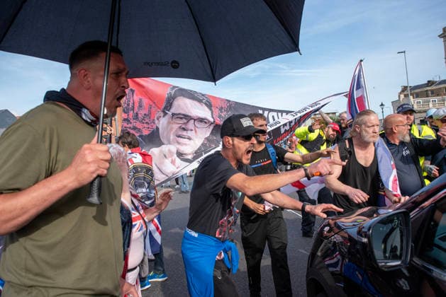 October 3, 2026, Dover, United Kingdom: Far-right protesters shout at a driver who tried to drive through on the crowd during a demonstration in Dover. Supporters of the English Defence League (EDL) gathered in Dover, UK to march through the town all the way to the harbour. English Defence League is an extreme far-right and Islamophobic organisation. It was founded by Tommy Robinson (pseudonym of Steven Yaxley-Lennon) in 2009. Dover United Kingdom - ZUMAs197 20261003_aaa_s197_248 Copyright: xKrisztianxElekx