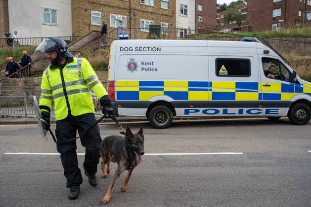 October 3, 2026, Dover, United Kingdom: A member of the police dog unit with his German Shepherd during a demonstration in Dover. Supporters of the English Defence League (EDL) gathered in Dover, UK to march through the town all the way to the harbour. English Defence League is an extreme far-right and Islamophobic organisation. It was founded by Tommy Robinson (pseudonym of Steven Yaxley-Lennon) in 2009. Dover United Kingdom - ZUMAs197 20261003_aaa_s197_251 Copyright: xKrisztianxElekx