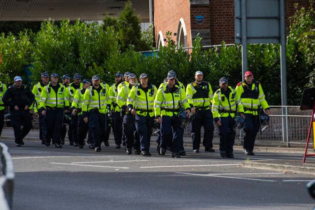 October 3, 2026, Dover, United Kingdom: Police officers march to the protest starting point in Dover. Supporters of the English Defence League (EDL) gathered in Dover, UK to march through the town all the way to the harbour. English Defence League is an extreme far-right and Islamophobic organisation. It was founded by Tommy Robinson (pseudonym of Steven Yaxley-Lennon) in 2009. Dover United Kingdom - ZUMAs197 20261003_aaa_s197_255 Copyright: xKrisztianxElekx