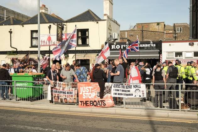 October 3, 2026, Dover, United Kingdom of Great Britain and Northern Ireland: DOVER, UNITED KINGDOM, OCTOBER 3, 2026: Anti-immigration protesters and anti-racism counter-protesters gather during rival demonstrations in Dover, Kent. Anti-immigration demonstrators carrying Union flags and St George s flags displayed banners calling for deportations and an end to small-boat crossings, while counter-protesters gathered nearby. Police maintained a significant presence between the groups and monitored the demonstrations. Dover United Kingdom of Great Britain and Northern Ireland - ZUMAq101 20261003_zna_q101_212 Copyright: xMarcxLewisx