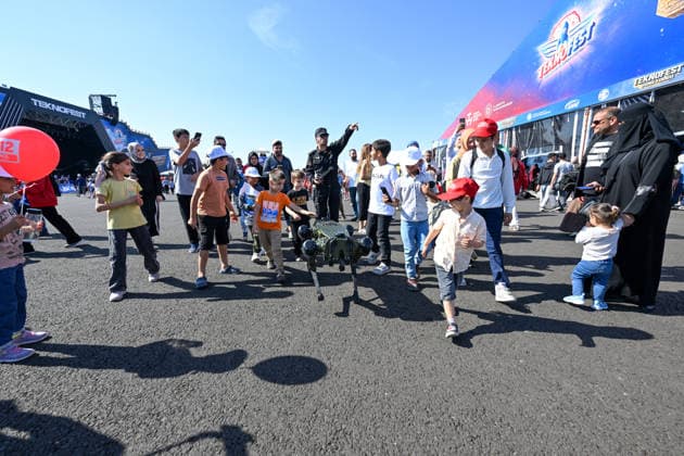 TEKNOFEST Southeast in Turkiye s Sanliurfa SANLIURFA, TURKIYE - OCTOBER 04: Children interact with a quadruped robot during TEKNOFEST, Turkiye s premier technology and aerospace event, at Sanliurfa GAP Airport in Sanliurfa, Turkiye, on October 04, 2026. The festival is organized by the Turkish Ministry of Industry and Technology and the T3 Foundation, with Anadolu serving as its Global Communication Partner. Adsiz Gunebakan Anadolu Sanliurfa Turkey. Editorial use only. Please get in touch for any other usage.  Copyright: x2026xAnadoluxAdsizxGunebakanx