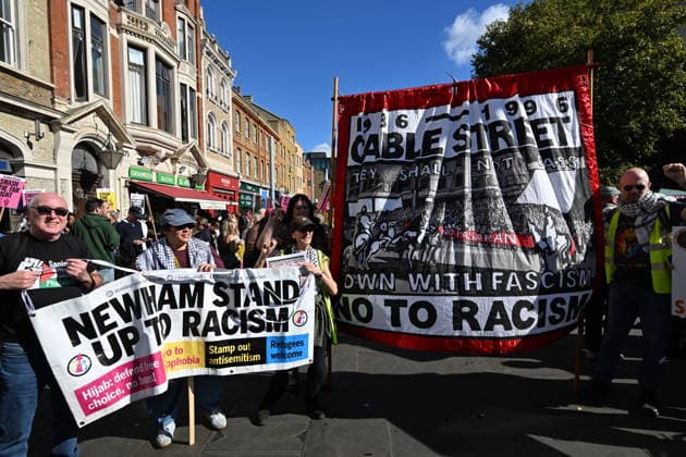October 4, 2026, London, London, UK: London, UK. Demonstators take part in a march and rally organist by Unite The Union to mark the 90th anniversary of The Battle of Cable Street in the East End of London. All over the country in 1936, Mosley s British Union of Fascists were chased off the streets by a strong working class who knew that the politics of hate and division offers no solutions. The Battle of Cable Street on 4 October 1936 was by far the countryÃ¢â‚¬â ¢s biggest mobilisation against fascism. London UK  - ZUMAl94_ 20261004_zaf_l94_030 Copyright: xRayxTangx