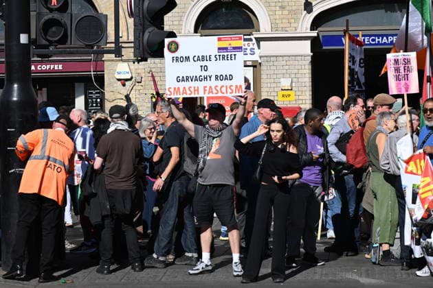October 4, 2026, London, London, UK: London, UK. Demonstators take part in a march and rally organist by Unite The Union to mark the 90th anniversary of The Battle of Cable Street in the East End of London. All over the country in 1936, Mosley s British Union of Fascists were chased off the streets by a strong working class who knew that the politics of hate and division offers no solutions. The Battle of Cable Street on 4 October 1936 was by far the countryÃ¢â‚¬â ¢s biggest mobilisation against fascism. London UK  - ZUMAl94_ 20261004_zaf_l94_033 Copyright: xRayxTangx