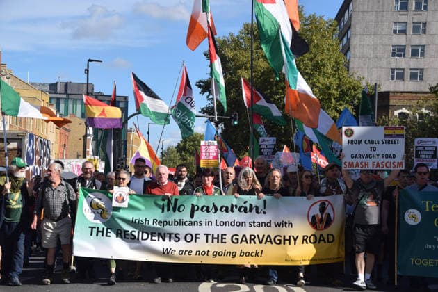 October 4, 2026, London, England, United Kingdom: Protesters, including Labour MP JOHN MCDONNELL, hold a banner stating Irish Republicans in London stand with the residents of the Garvaghy Road in Whitechapel during the march to Cable Street against racism and fascism, marking the 90th anniversary since the Battle of Cable Street. London United Kingdom  - ZUMAv130 20261004_zip_v130_014 Copyright: xVukxValcicx