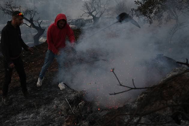 Israeli Settlers Set Fire To Olive Trees And Car Scrap Yard Near Silwad SILWAD, WEST BANK, PALESTINE OCTOBER 4, 2026: Israeli settlers set fire to olive trees and a car scrap yard between the villages of Ein Yabrud and Silwad, according to the information provided. The owner of the repair shop said more than 50 cars were destroyed in the fire. The incident occurred amid ongoing attacks targeting Palestinian property and agricultural land in the area. Fires affecting olive trees and other Palestinian property have also been reported in areas around Silwad. Ramallah Palestine, State of Copyright: x xSalmanxMohsenxAlkhatibx xJNAxPressx