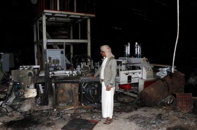 (261004) -- SANAA, Oct. 4, 2026 -- A worker inspects a sponge factory after it was struck by an airstrike carried out by a Saudi warplane in Sanaa, Yemen, on Oct. 4, 2026. Yemen s Houthi group said Sunday that Saudi Arabia had launched 106 air and missile strikes across Houthi-held areas over the past 24 hours, as the internationally recognized government announced a new military campaign to retake territory from the group amid a widening escalation in the country. (Photo by Xinhua) YEMEN-SANAA-SAUDI AIRSTRIKES MohammedxMohammed 
