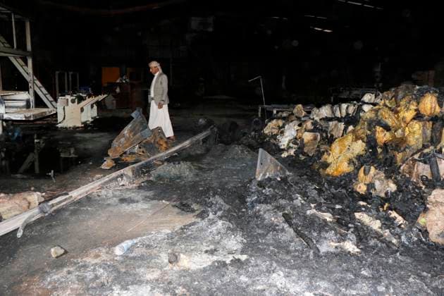 (261004) -- SANAA, Oct. 4, 2026 -- A worker inspects a sponge factory after it was struck by an airstrike carried out by a Saudi warplane in Sanaa, Yemen, on Oct. 4, 2026. Yemen s Houthi group said Sunday that Saudi Arabia had launched 106 air and missile strikes across Houthi-held areas over the past 24 hours, as the internationally recognized government announced a new military campaign to retake territory from the group amid a widening escalation in the country. (Photo by Xinhua) YEMEN-SANAA-SAUDI AIRSTRIKES MohammedxMohammed 