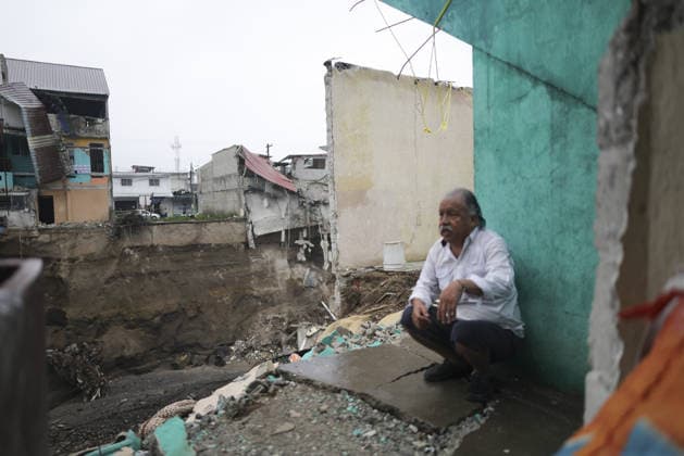 Heavy rains linked to El Nino trigger severe land collapse in Guatemala SAN MIGUEL PETAPA, GUATEMALA - OCTOBER 04: Residents try to go on with their daily lives amid severe damage and collapsed structures in the Villa Hermosa I neighborhood following relentless rainfall and the overflow of the Pinula River in San Miguel Petapa, Guatemala on October 04, 2026. The rising waters, linked to the El Nino phenomenon, triggered extensive riverbank erosion and land loss, damaging several homes and leaving nearby properties at continuous risk of collapse. Luis Vargas Anadolu San Miguel Petapa Guatemala. Editorial use only. Please get in touch for any other usage.  Copyright: x2026xAnadoluxLuisxVargasx