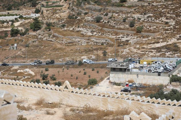 Israeli fire kills one Palestinian, injures two in West Bank, Palestine WEST BANK, PALESTINE - OCTOBER 05: Israeli soldiers and military vehicles are deployed near the entrance to Bani Naim, east of Hebron, after troops opened fire on a moving vehicle, on October 05, 2026 in West Bank, Palestine. One Palestinian was killed and two young Palestinians were injured in the shooting. Israeli forces later secured the area and carried out an inspection, while separate attacks by Israeli settlers elsewhere in West Bank left additional Palestinians injured. Wisam Hashlamoun Anadolu Hebron West Bank. Editorial use only. Please get in touch for any other usage.  Copyright: x2026xAnadoluxWisamxHashlamounx