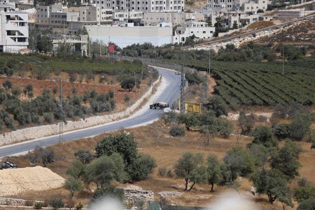Israeli fire kills one Palestinian, injures two in West Bank, Palestine WEST BANK, PALESTINE - OCTOBER 05: Israeli soldiers and military vehicles are deployed near the entrance to Bani Naim, east of Hebron, after troops opened fire on a moving vehicle, on October 05, 2026 in West Bank, Palestine. One Palestinian was killed and two young Palestinians were injured in the shooting. Israeli forces later secured the area and carried out an inspection, while separate attacks by Israeli settlers elsewhere in West Bank left additional Palestinians injured. Wisam Hashlamoun Anadolu Hebron West Bank. Editorial use only. Please get in touch for any other usage.  Copyright: x2026xAnadoluxWisamxHashlamounx