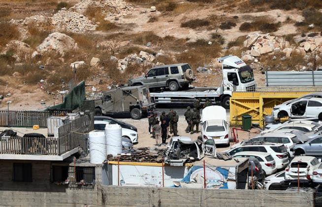 Israeli fire kills one Palestinian, injures two in West Bank, Palestine WEST BANK, PALESTINE - OCTOBER 05: Israeli soldiers and military vehicles are deployed near the entrance to Bani Naim, east of Hebron, after troops opened fire on a moving vehicle, on October 05, 2026 in West Bank, Palestine. One Palestinian was killed and two young Palestinians were injured in the shooting. Israeli forces later secured the area and carried out an inspection, while separate attacks by Israeli settlers elsewhere in West Bank left additional Palestinians injured. Wisam Hashlamoun Anadolu Hebron West Bank. Editorial use only. Please get in touch for any other usage.  Copyright: x2026xAnadoluxWisamxHashlamounx