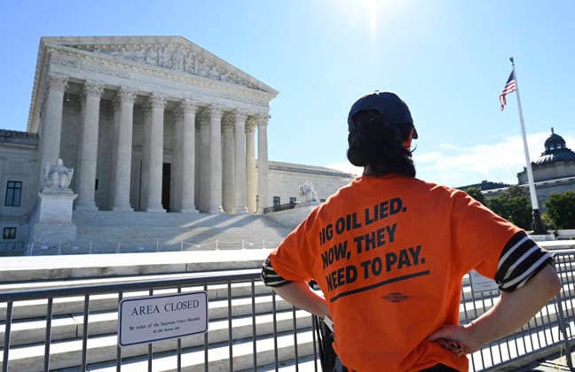 Supreme Court Hears Major Climate Case Against Oil Companies People protest in front of the US Supreme Court as the court considers the Suncor v. Boulder case in Washington, DC, on October 5, 2026. The justices are considering whether states and localities can try to hold oil companies responsible for damages from climate change. If Boulder, Colo., wins, the companies could owe enormous sums.Photo by Olivier Douliery ABACAPRESS.COM Washington DC United States  Copyright: xDoulieryxOlivier ABACAx