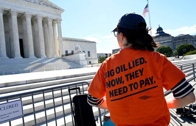 Supreme Court Hears Major Climate Case Against Oil Companies People protest in front of the US Supreme Court as the court considers the Suncor v. Boulder case in Washington, DC, on October 5, 2026. The justices are considering whether states and localities can try to hold oil companies responsible for damages from climate change. If Boulder, Colo., wins, the companies could owe enormous sums.Photo by Olivier Douliery ABACAPRESS.COM Washington DC United States  Copyright: xDoulieryxOlivier ABACAx