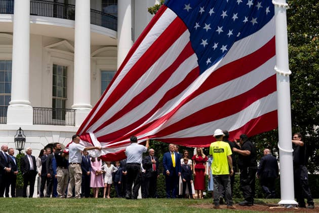 October 5, 2026, Washington, Dc, United States of America: An American flag is raised on a newly installed flagpole on the South Lawn of the White House as U.S. President Donald Trump, family members and guests look on, June 18, 2025 in Washington, D.C. The flag was raised on one of two new flagpoles Trump had installed on the North and South Lawns of the White House, which he said he paid for personally. Washington United States of America - ZUMAp138 20261005_zaa_p138_093 Copyright: xAndreaxHanks WhitexHousex