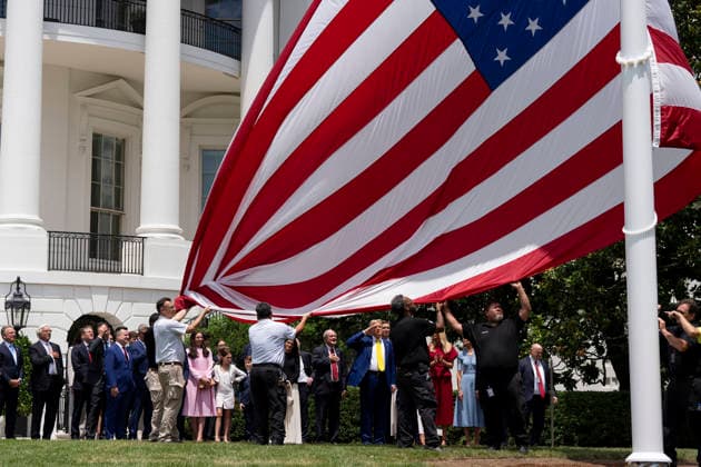 October 5, 2026, Washington, Dc, United States of America: An American flag is raised on a newly installed flagpole on the South Lawn of the White House as U.S. President Donald Trump, family members and guests look on, June 18, 2025 in Washington, D.C. The flag was raised on one of two new flagpoles Trump had installed on the North and South Lawns of the White House, which he said he paid for personally. Washington United States of America - ZUMAp138 20261005_zaa_p138_096 Copyright: xAndreaxHanks WhitexHousex