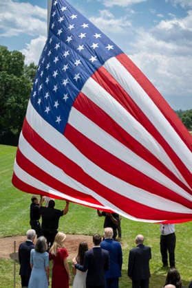October 5, 2026, Washington, Dc, United States of America: An American flag is raised on a newly installed flagpole on the South Lawn of the White House as U.S. President Donald Trump, family members and guests look on, June 18, 2025 in Washington, D.C. The flag was raised on one of two new flagpoles Trump had installed on the North and South Lawns of the White House, which he said he paid for personally. Washington United States of America - ZUMAp138 20261005_zaa_p138_087 Copyright: xMollyxRiley WhitexHousex