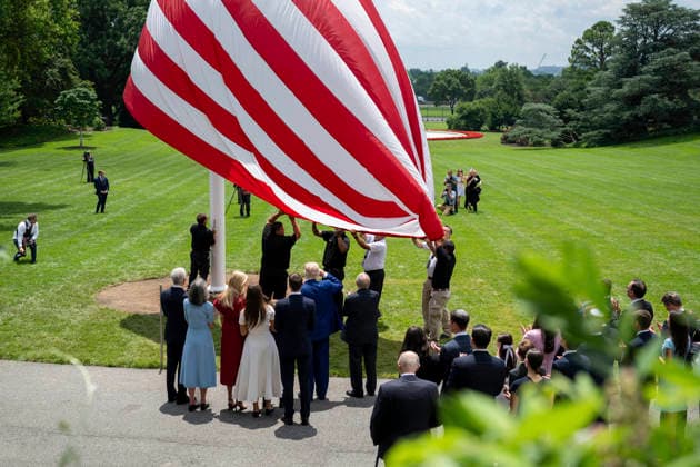 October 5, 2026, Washington, Dc, United States of America: An American flag is raised on a newly installed flagpole on the South Lawn of the White House as U.S. President Donald Trump, family members and guests look on, June 18, 2025 in Washington, D.C. The flag was raised on one of two new flagpoles Trump had installed on the North and South Lawns of the White House, which he said he paid for personally. Washington United States of America - ZUMAp138 20261005_zaa_p138_076 Copyright: xMollyxRiley WhitexHousex