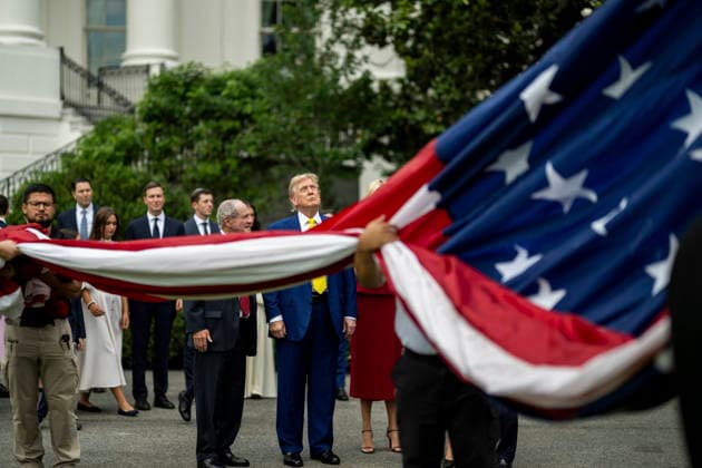 October 5, 2026, Washington, Dc, United States of America: U.S. President Donald Trump watches as workers unfurl an American flag to be raised on a newly installed flagpole on the South Lawn of the White House, June 18, 2025 in Washington, D.C. The flag was raised on one of two new flagpoles Trump had installed on the North and South Lawns of the White House, which he said he paid for personally. Washington United States of America - ZUMAp138 20261005_zaa_p138_042 Copyright: xDanielxTorok WhitexHousex